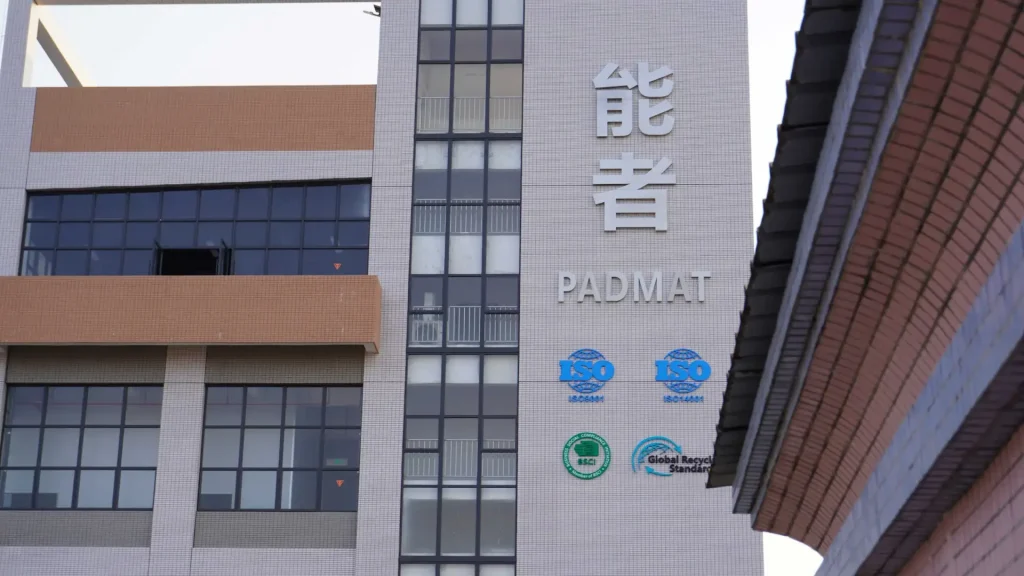 Padmat Rubber factory building exterior with ISO 9001, ISO 14001, BSCI, and GRS certification logos