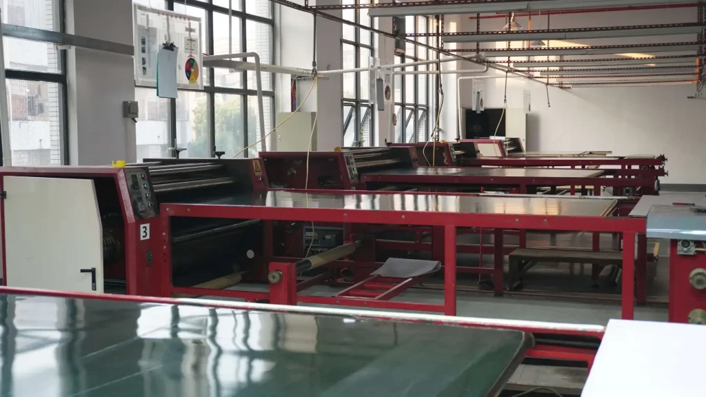 Heat transfer machine at Padmat Rubber factory for custom mousepad printing and OEM manufacturing