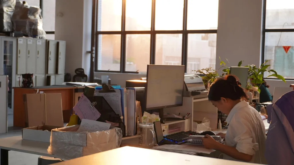 Office worker at Padmat Rubber custom mousepad factory, administrative and planning team in office