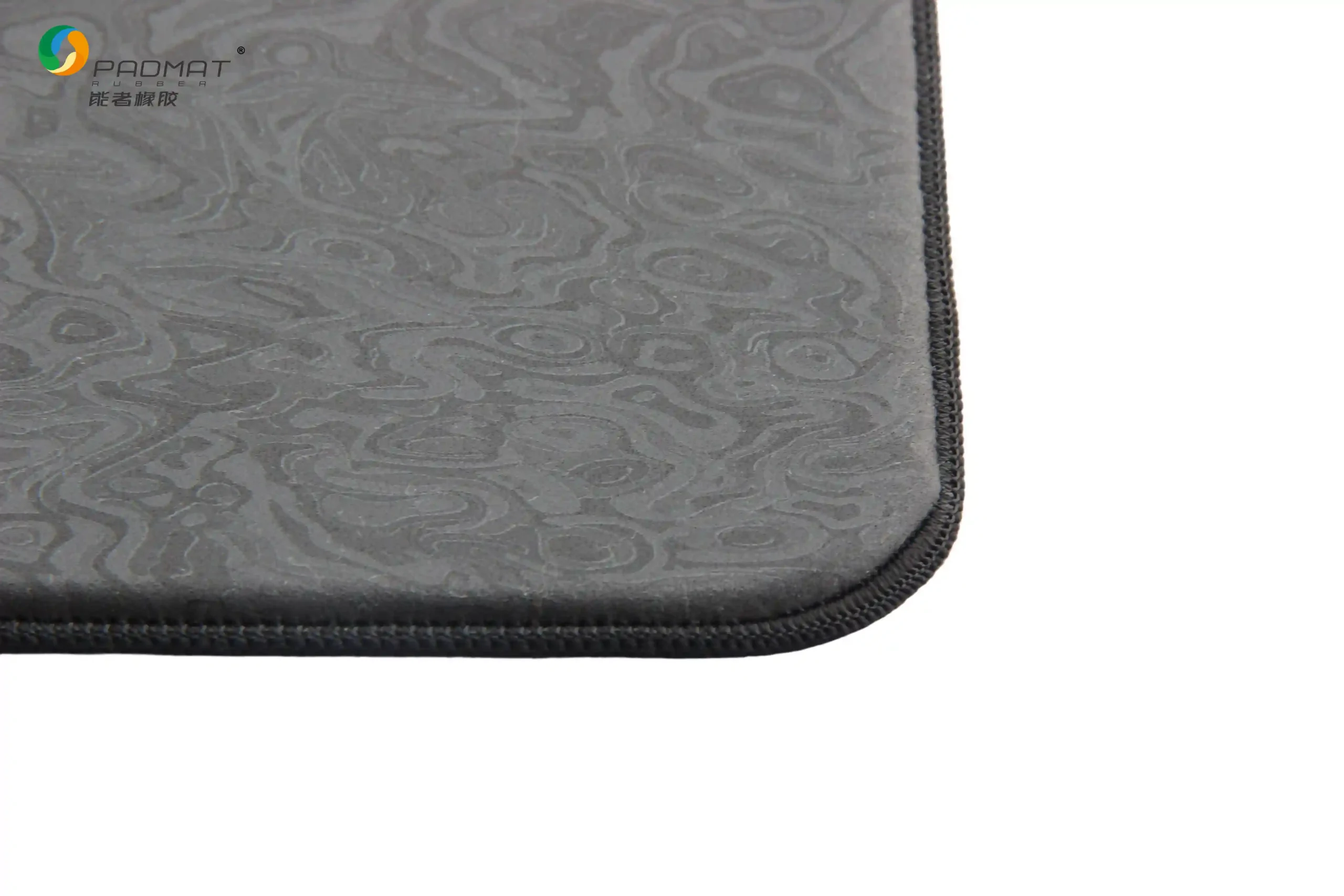 Close-up of Artifact Spirit gaming mouse pad showing black edge stitching for durable construction and long-lasting performance.