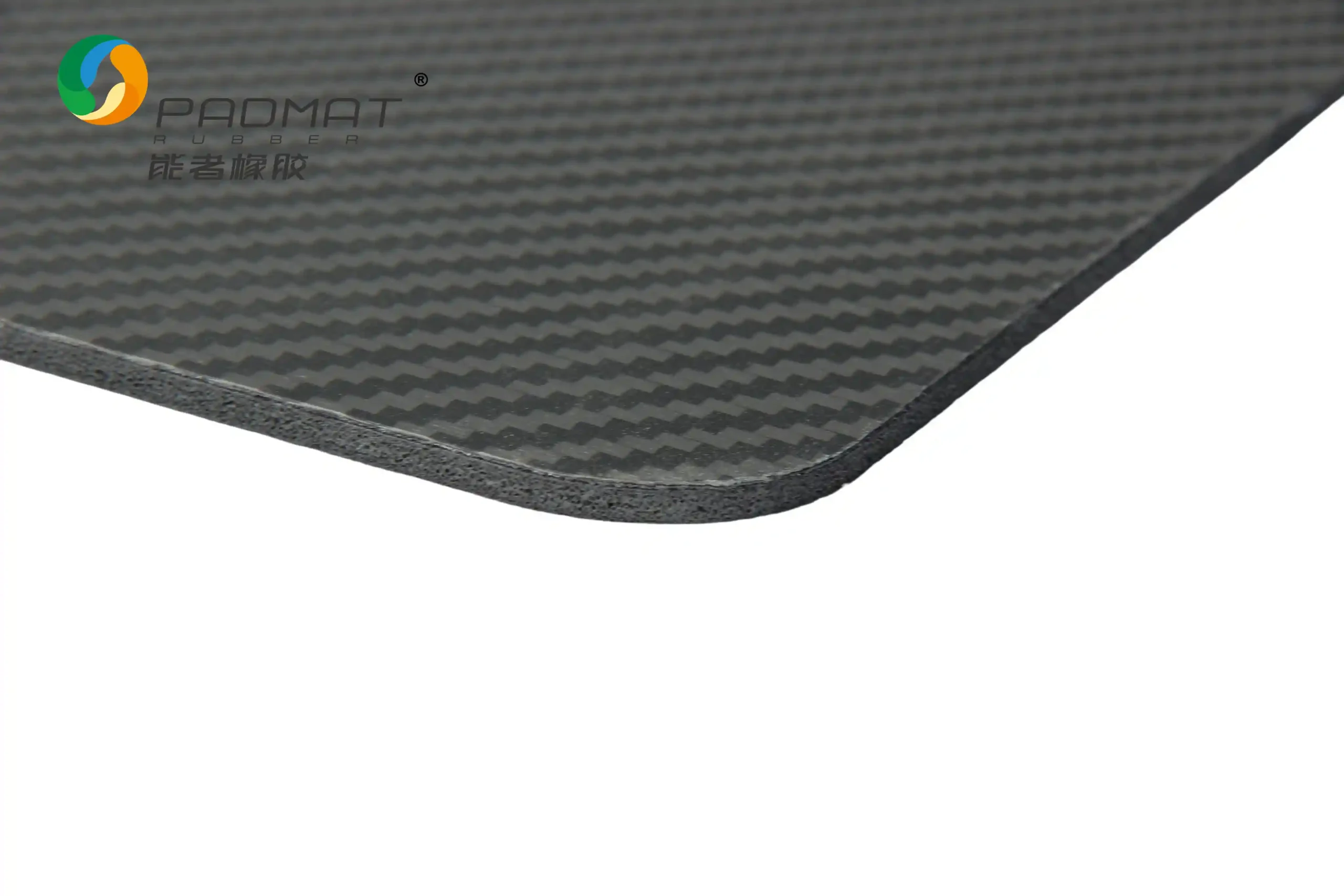 Close-up of Carbon Fiber gaming mouse pad curved edge showing high-end carbon fiber twill weave texture, frosted coating, and fine sand feel.