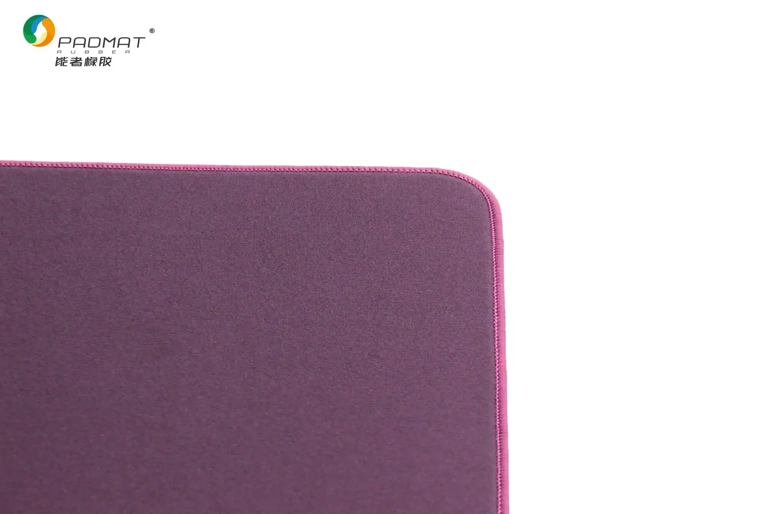 Close-up of Danming speed gaming mouse pad showing purple edge stitching and smooth fabric texture for low friction and durable construction.