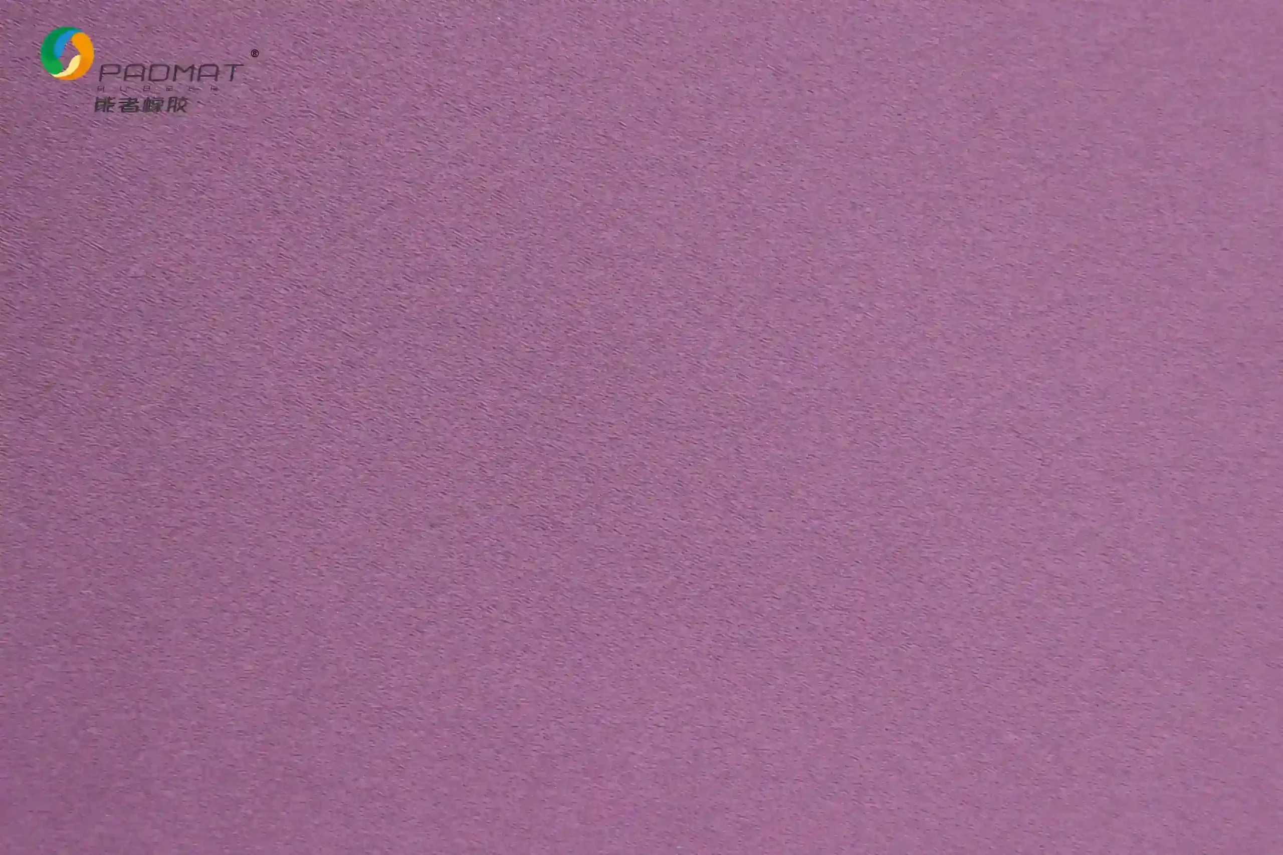 Close-up of Danming speed gaming mouse pad showing purple fabric texture with high-speed oriented weave structure for low friction and smooth glide.