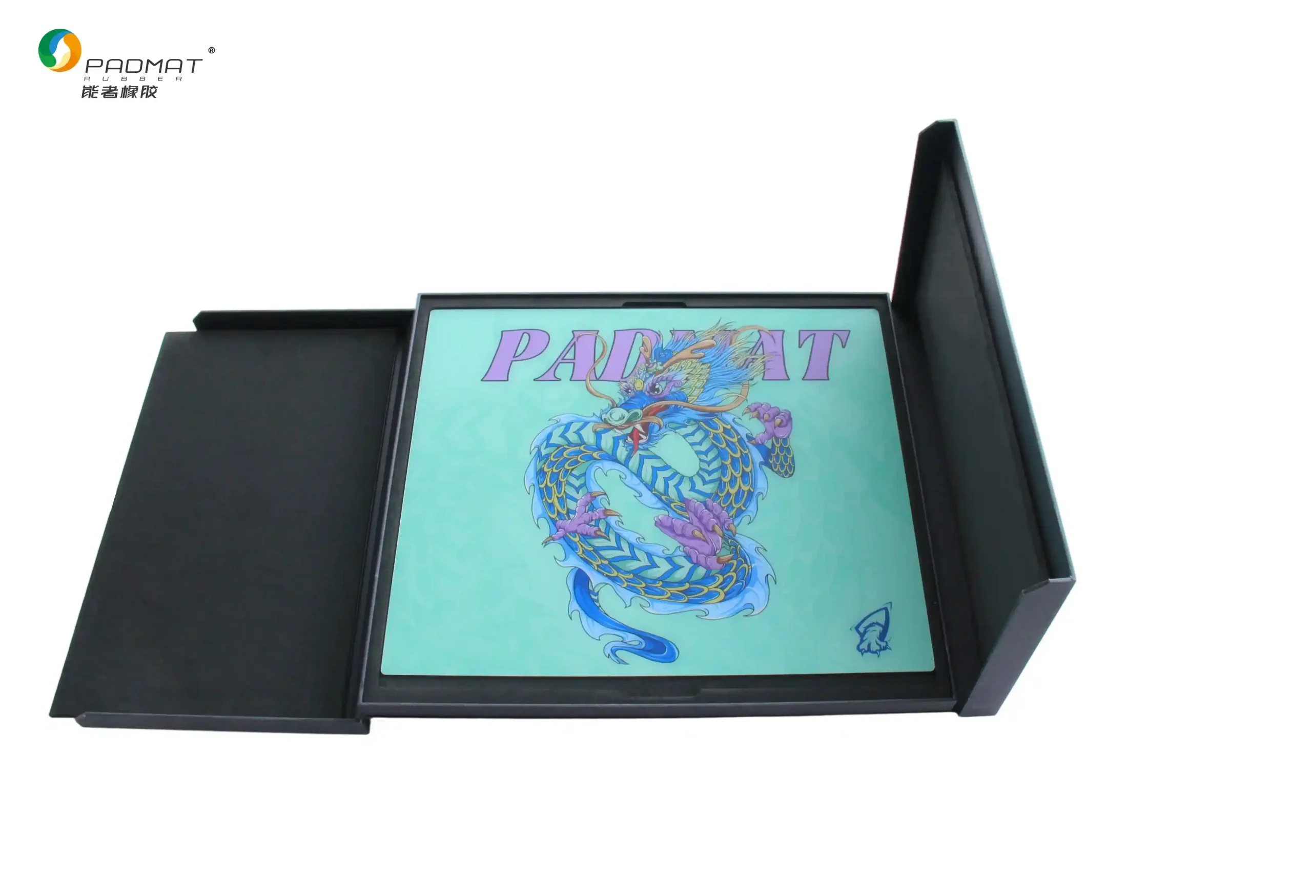 Padmat glass gaming mouse pad with blue dragon artwork displayed inside an open black premium packaging box, showcasing product presentation.