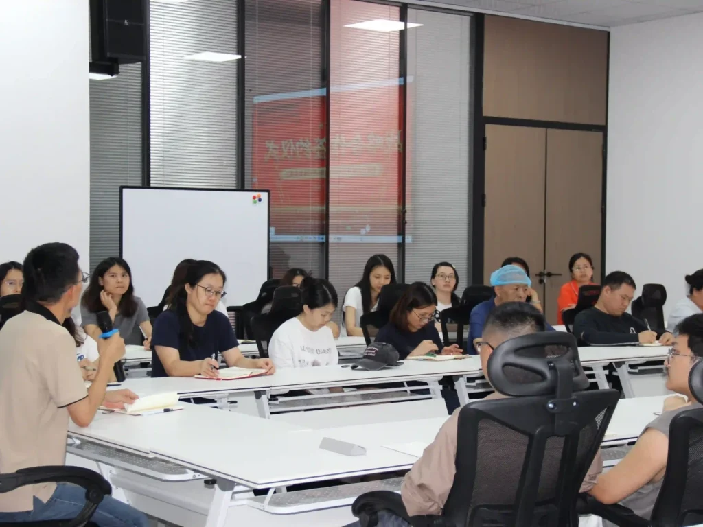 PADMAT internal business school kickoff meeting, all staff attending lecture and interactive discussion