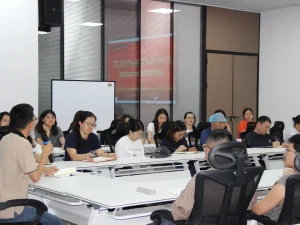 PADMAT internal business school kickoff meeting, all staff attending lecture and interactive discussion