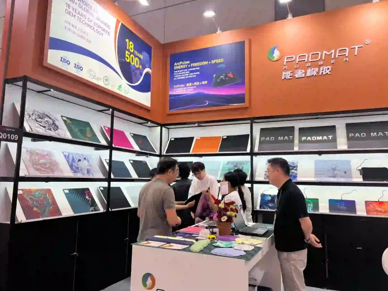 Close-up of PADMAT booth at Computex, showcasing product display wall and client consultation