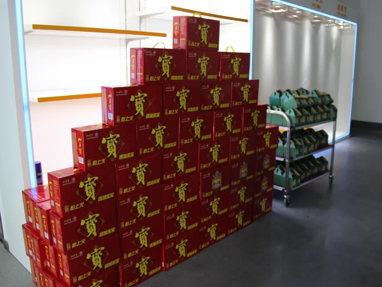 Warehouse display of Patmat Dragon Boat Festival holiday gifts, stacked red premium gift boxes and racked zongzi gift boxes prepared for all employees