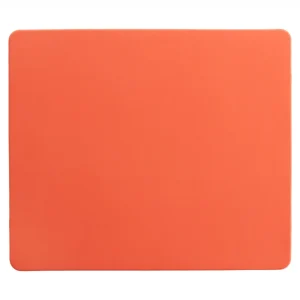 Shaoyang gaming mouse pad with solid orange surface and rounded corners, designed for balanced glide and precise positioning.